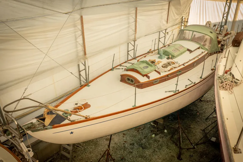 Slide: The Image of 1965 Concordia 39 sailboat in storage, showcasing classic design and craftsmanship. - 8