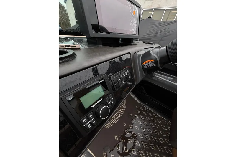 Slide: The Image of Dashboard of 2026 Bennington 22 M Swingback with modern controls and display. - 16