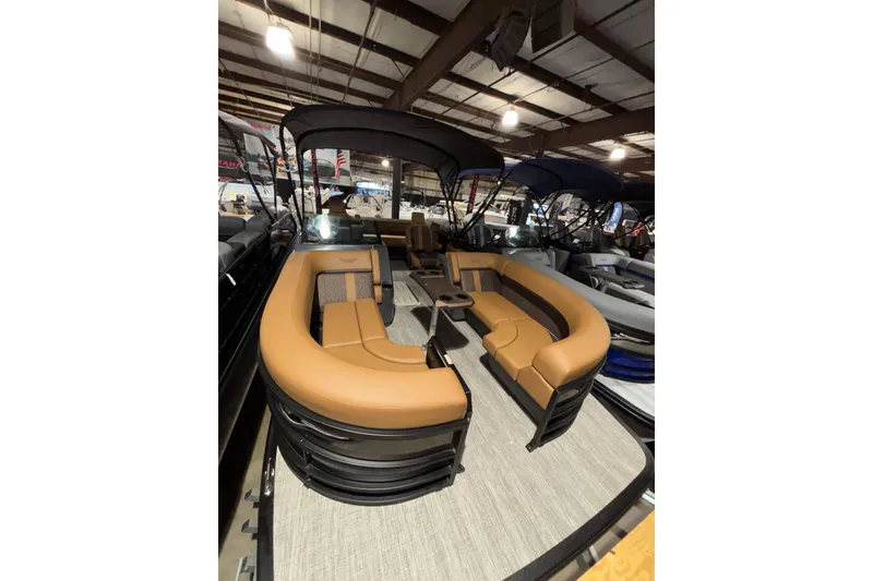 Slide: The Image of 2026 Bennington 22 M Swingback boat seat with tan and gray diamond pattern upholstery. - 3