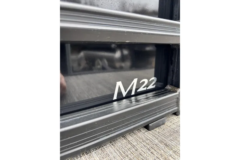 Slide: The Image of Close-up of Bennington 22 M Swingback 2026 model with "M22" marking. - 4