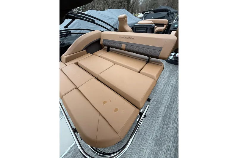 Slide: The Image of 2026 Bennington 22 M Swingback boat with tan leather seating and stylish design. - 9