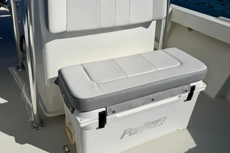 Slide: The Image of 2024 Parker 2100 Special Edition boat interior with cushioned seating and storage. - 15