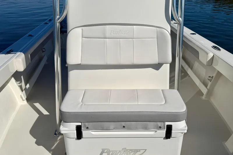 Slide: The Image of 2024 Parker 2100 Special Edition boat seat with white cushioned backrest and cooler. - 16