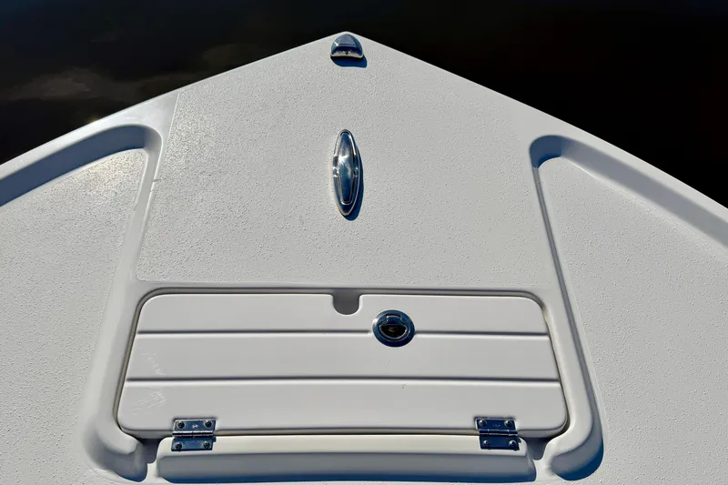 Slide: The Image of 2024 Parker 2100 Special Edition boat deck with storage compartment and sleek design. - 28