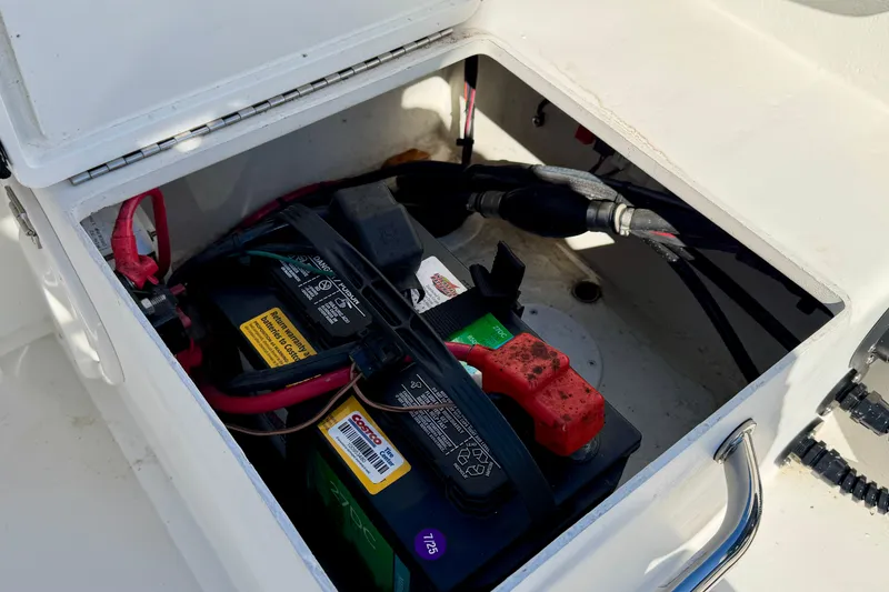 Slide: The Image of Battery compartment of 2024 Parker 2100 Special Edition boat, showing wiring and connections. - 30