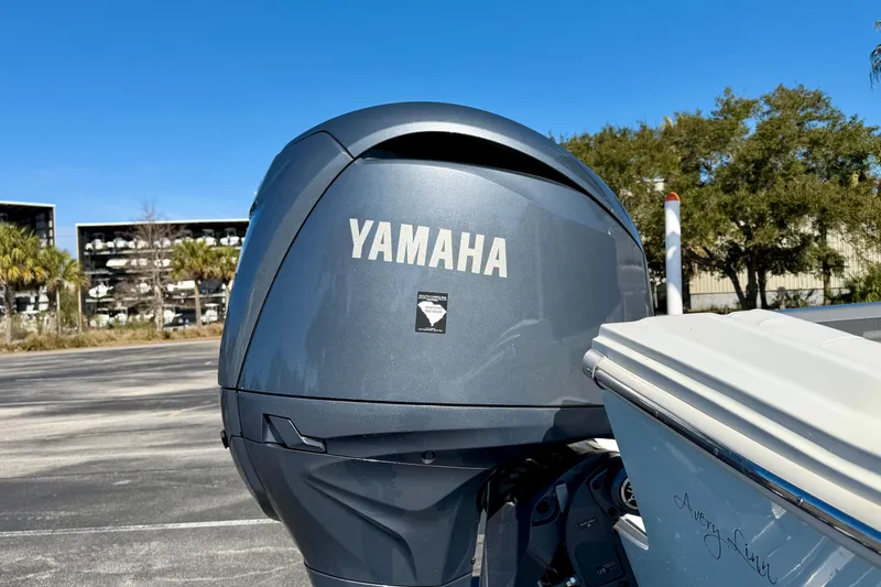 Slide: The Image of Yamaha outboard motor on 2024 Parker 2100 Special Edition boat, sunny day. - 44