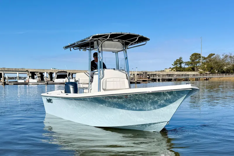 Slide: The Image of 2024 Parker 2100 Special Edition boat on calm water, featuring a sleek design. - 6