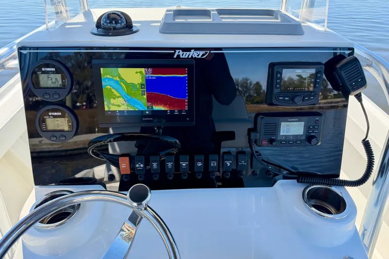 Slide: The Image of 2024 Parker 2100 Special Edition boat dashboard with navigation and control systems. - 8