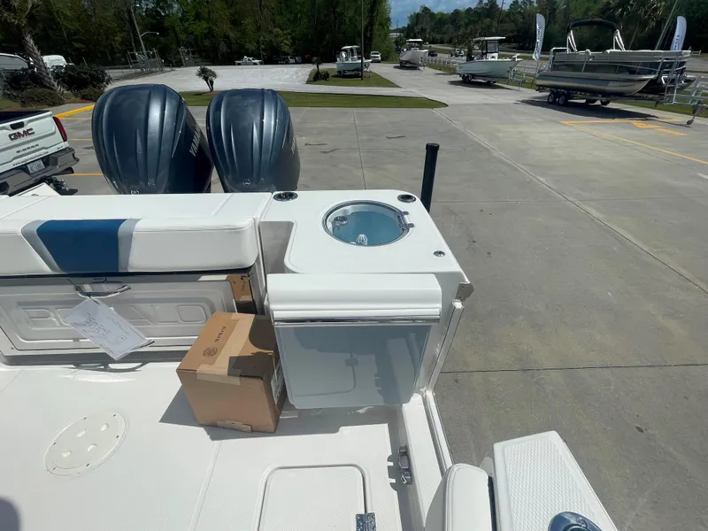 Slide: The Image of 2023 Robalo R270 boat with twin engines and deck storage. - 29