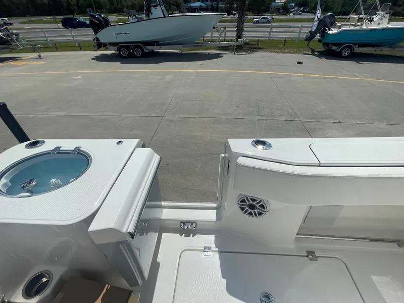 Slide: The Image of 2023 Robalo R270 boat deck with livewell and seating area. - 30