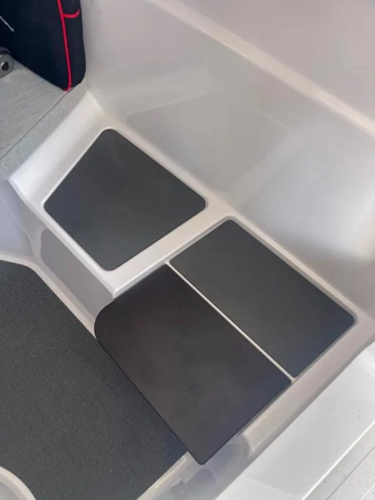 Slide: The Image of 2024 Axopar 25 Cross Top interior flooring detail. - 16