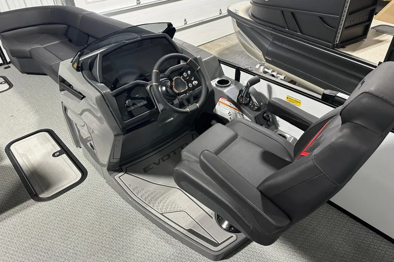 Slide: The Image of Interior of 2026 Evotti 725CS boat with modern seating and steering console. - 15