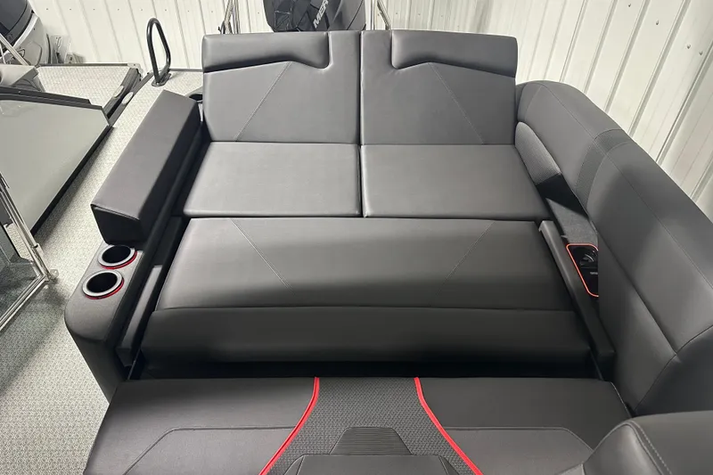 Slide: The Image of Luxurious black seating in 2026 Evotti 725CS boat with cup holders and sleek design. - 21