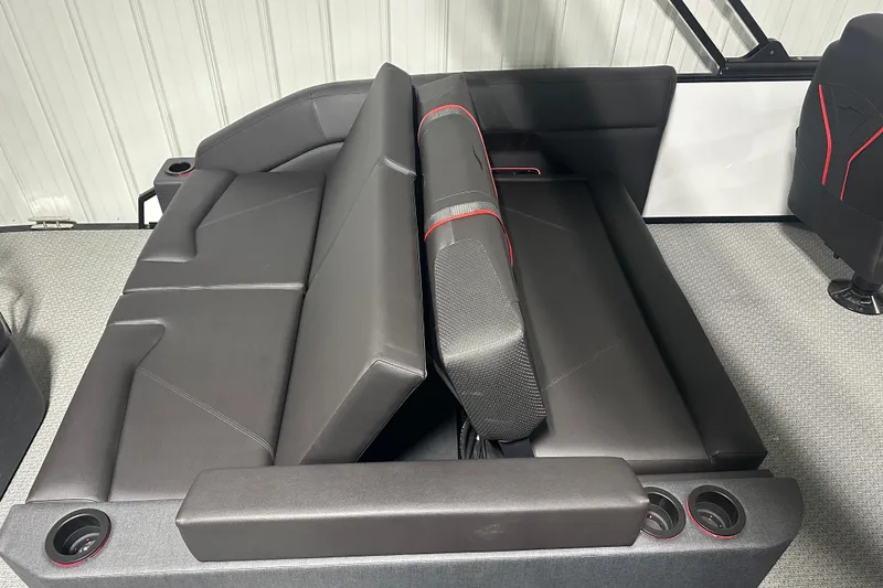 Slide: The Image of 2026 Evotti 725CS boat interior with sleek black seating and integrated cup holders. - 22