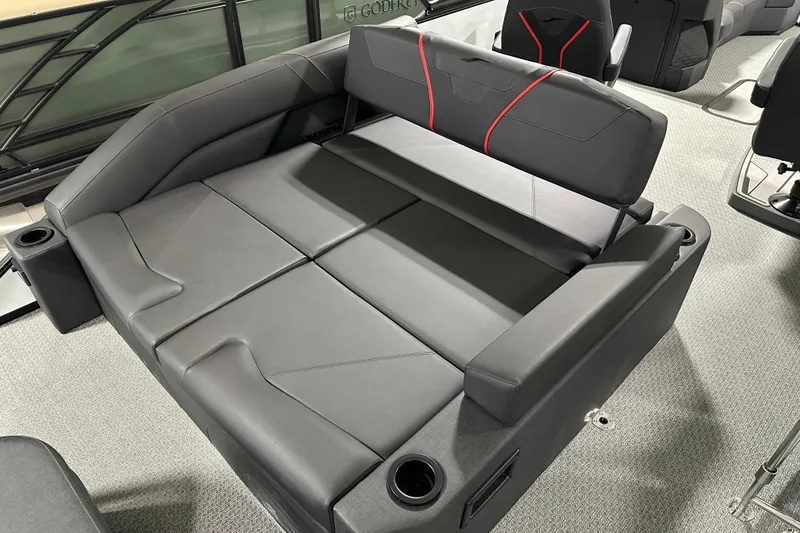 Slide: The Image of 2026 Evotti 725CS boat interior with sleek black seating and cup holders. - 5