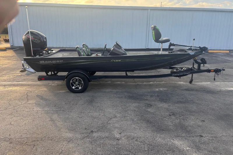The Image of 2022 Ranger RT188 fishing boat on trailer, parked outdoors. - 1