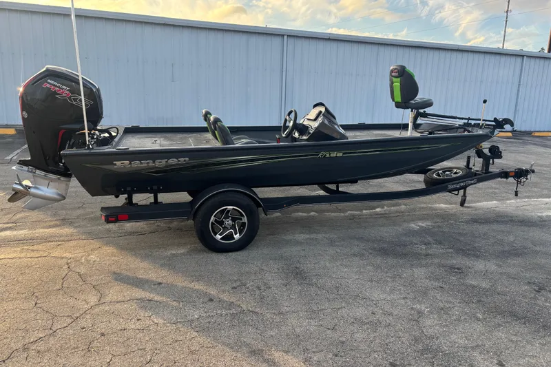 Slide: The Image of 2022 Ranger RT188 fishing boat on trailer, featuring a Mercury engine. - 13