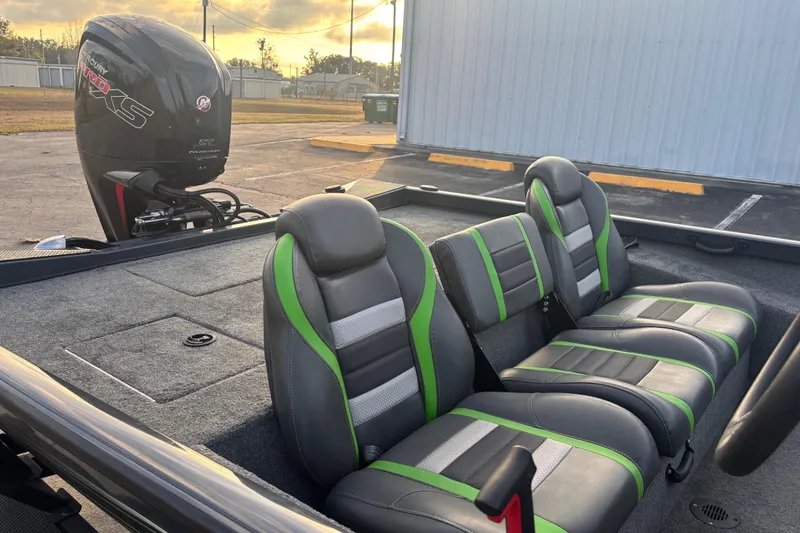 Slide: The Image of 2022 Ranger RT188 boat interior with green-accented seats and Mercury Pro XS engine. - 15