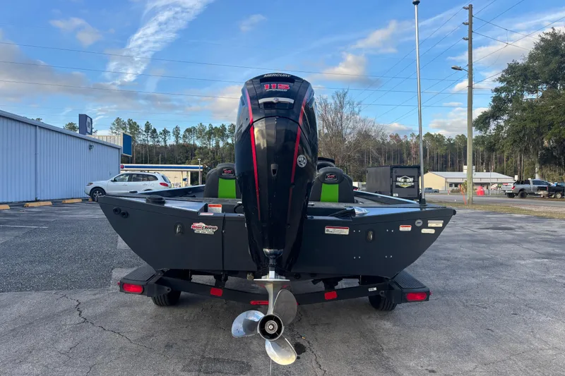 Slide: The Image of 2022 Ranger RT188 boat with Mercury outboard motor, parked outdoors. - 3