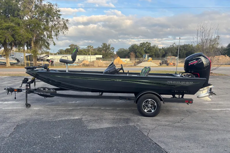 Slide: The Image of 2022 Ranger RT188 fishing boat with trailer, parked outdoors. - 5