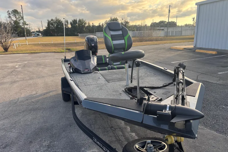 Slide: The Image of 2022 Ranger RT188 fishing boat with motor, parked outdoors on a sunny day. - 8