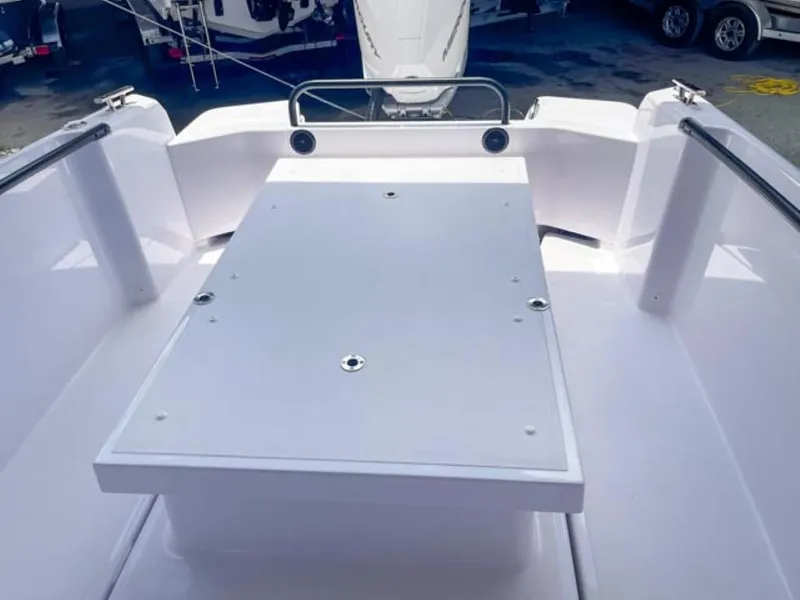 Slide: The Image of 2024 Axopar 25 Cross Top boat deck with sleek white finish. - 18