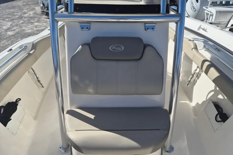 Slide: The Image of 2021 Key West 239 FS boat interior with cushioned seating and stainless steel frame. - 6