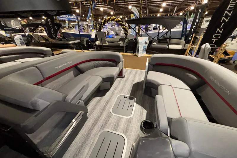 Slide: The Image of 2026 Bennington 23 M Open Fast Back pontoon boat interior at a boat show. - 10