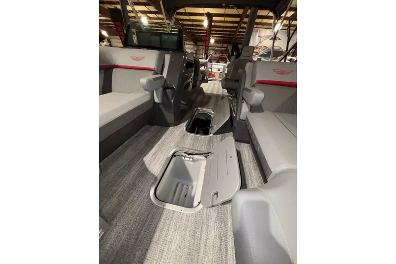 Slide: The Image of Interior of 2026 Bennington 23 M Open Fast Back boat with open storage compartments. - 4