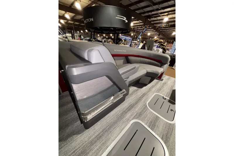 Slide: The Image of 2026 Bennington 23 M Open Fast Back pontoon boat interior with modern seating design. - 6
