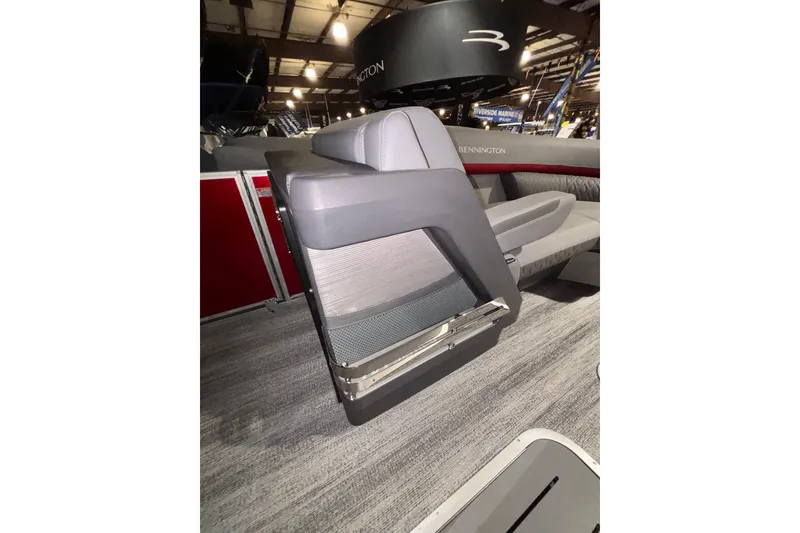 Slide: The Image of 2026 Bennington 23 M Open Fast Back boat interior with modern seating design. - 9