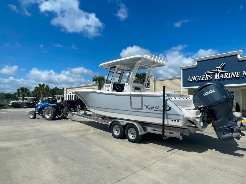 Slide: The Image of 2023 Robalo R270 boat on trailer at Anglers Marine dealership. - 3