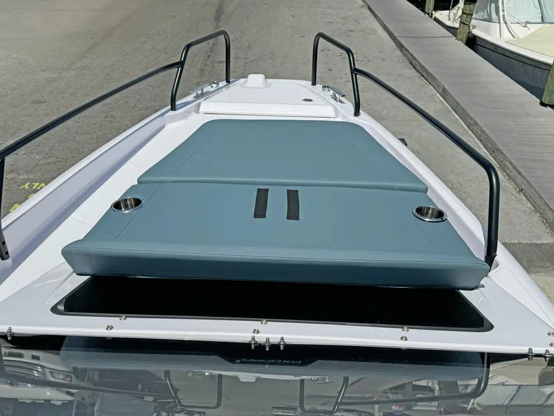 Slide: The Image of 2025 Axopar 25 Cross Top boat with sleek deck design and comfortable seating. - 12
