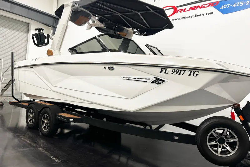Slide: The Image of 2022 Nautique Super Air Nautique G23 boat on trailer in showroom. - 3