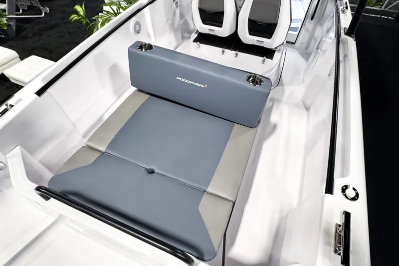 Slide: The Image of 2025 Axopar 25 Cross Top boat interior with sleek seating and modern design. - 4