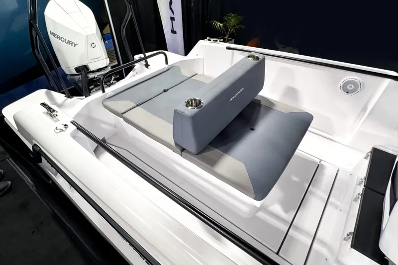 Slide: The Image of 2025 Axopar 25 Cross Top boat interior with Mercury engine and seating area. - 5