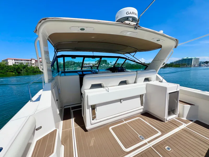 Slide: The Image of 1998 Tiara Yachts 3500 Express boat with spacious deck and modern navigation equipment. - 10