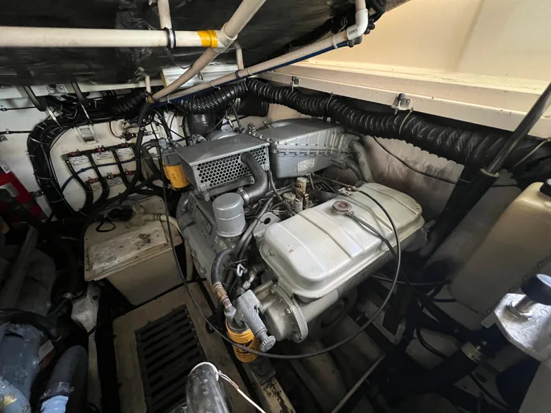 Slide: The Image of Engine room of a 1998 Tiara Yachts 3500 Express, showcasing mechanical components and wiring. - 28