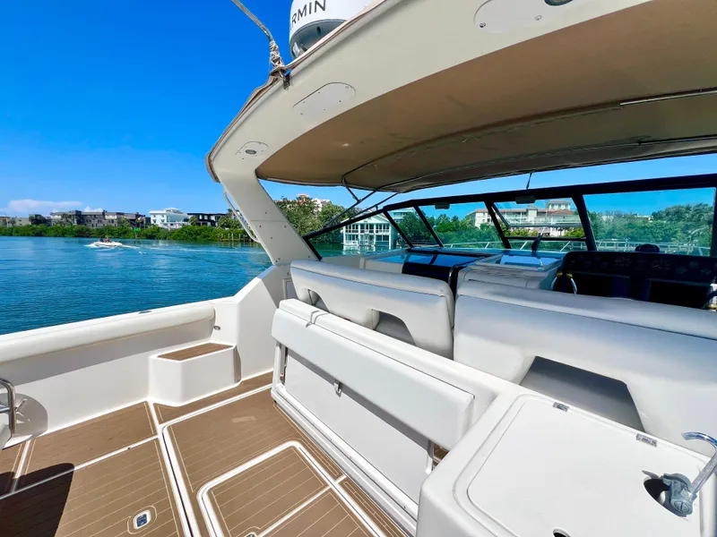 Slide: The Image of 1998 Tiara Yachts 3500 Express interior with scenic waterfront view. - 7