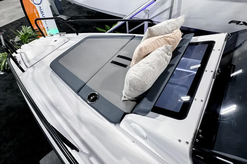 Slide: The Image of 2025 Axopar 25 Cross Top boat with cushioned seating and sleek design. - 17