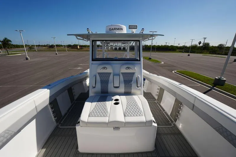 Slide: The Image of 2025 Renaissance Prowler 31 boat interior with luxurious seating and Garmin navigation system. - 8