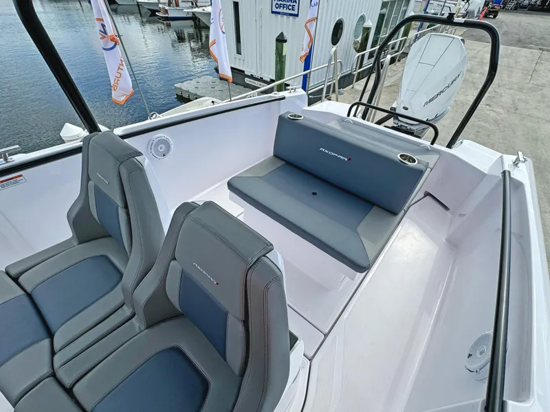 Slide: The Image of 2025 Axopar 25 Cross Top boat interior with sleek seating and modern design. - 14