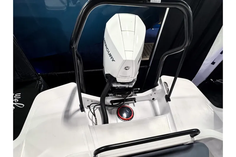 Slide: The Image of 2025 Axopar 25 Cross Top boat with Mercury Verado engine, rear view. - 3