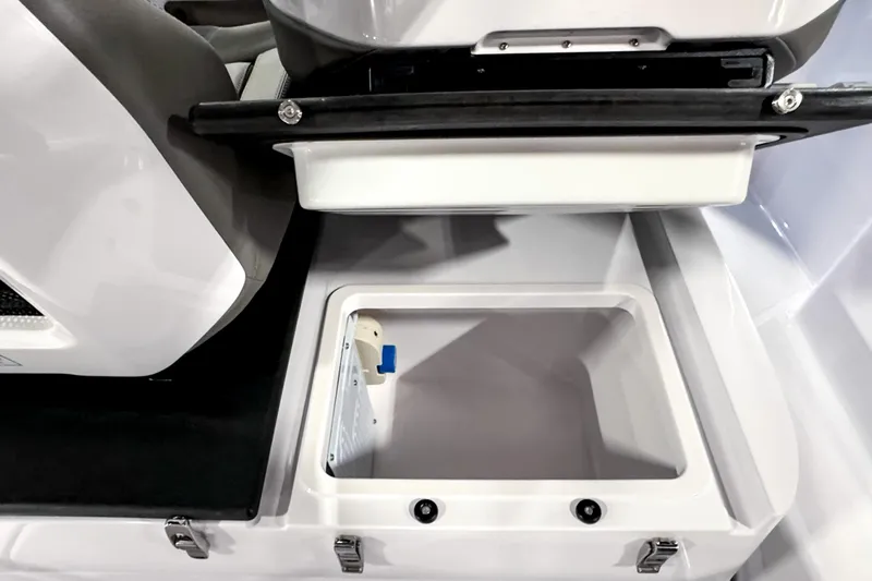 Slide: The Image of 2025 Axopar 25 Cross Top boat storage compartment, open and empty. - 6