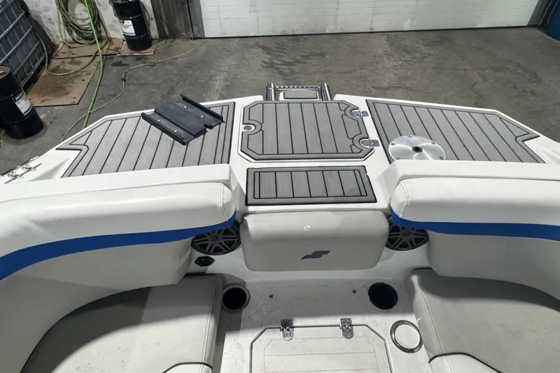 Slide: The Image of 2021 Starcraft SVX 231 OB boat interior with gray decking and seating. - 11