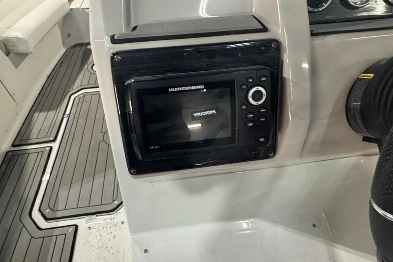 Slide: The Image of 2021 Starcraft SVX 231 OB boat dashboard with Humminbird Helix 5 display. - 16