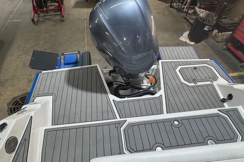 Slide: The Image of 2021 Starcraft SVX 231 OB boat with outboard motor and gray deck flooring. - 17