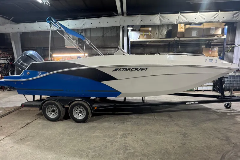 Slide: The Image of 2021 Starcraft SVX 231 OB boat on trailer in indoor storage facility. - 3