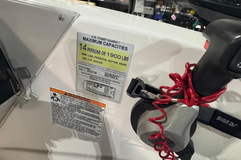 Slide: The Image of 2021 Starcraft SVX 231 OB boat capacity label, 14 persons or 1900 lbs, safety warnings visible. - 8