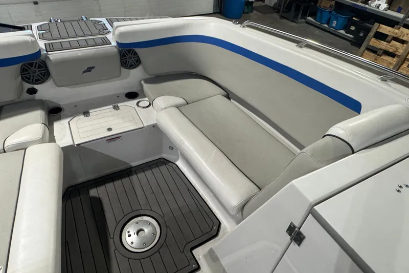 Slide: The Image of 2021 Starcraft SVX 231 OB boat interior with cushioned seating and storage compartments. - 9